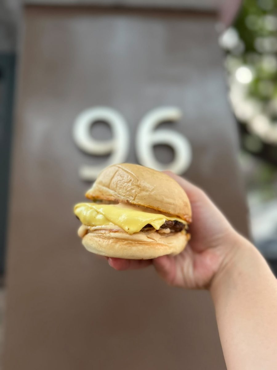 96 Street Burger held in front of house number 96